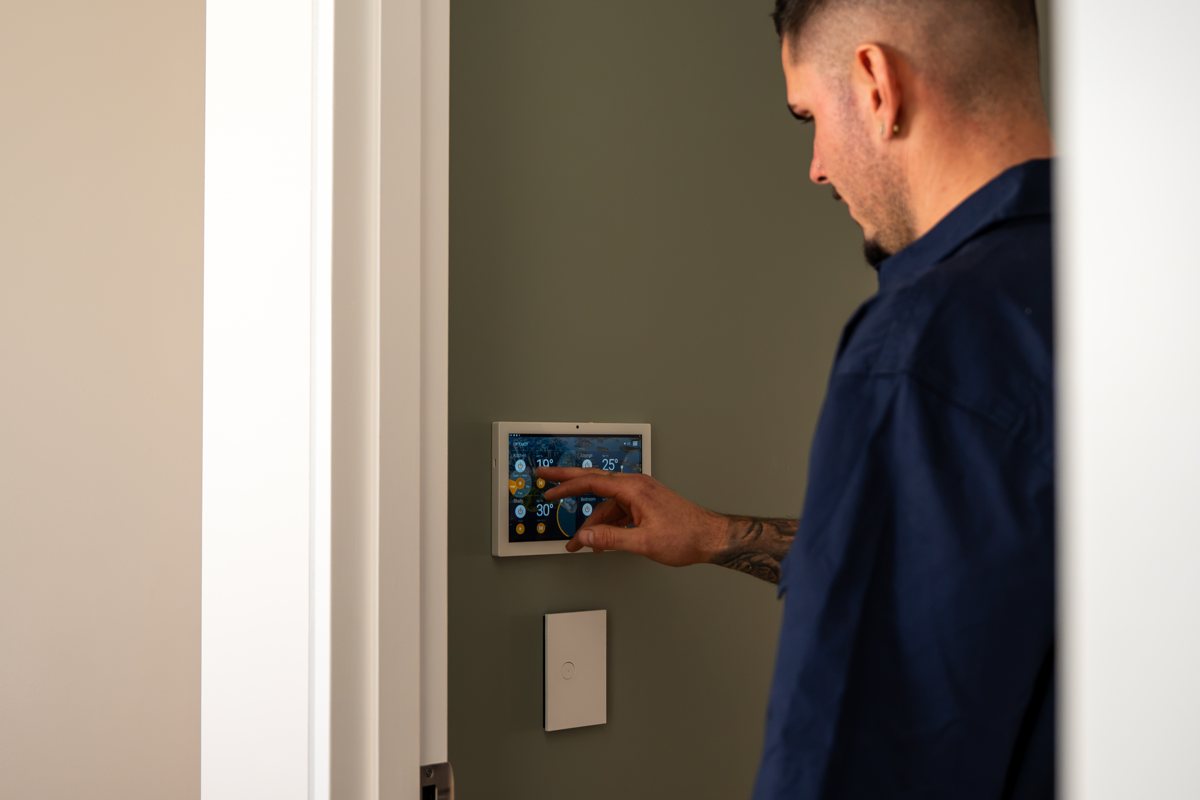 Technician setting up an air conditioning controller