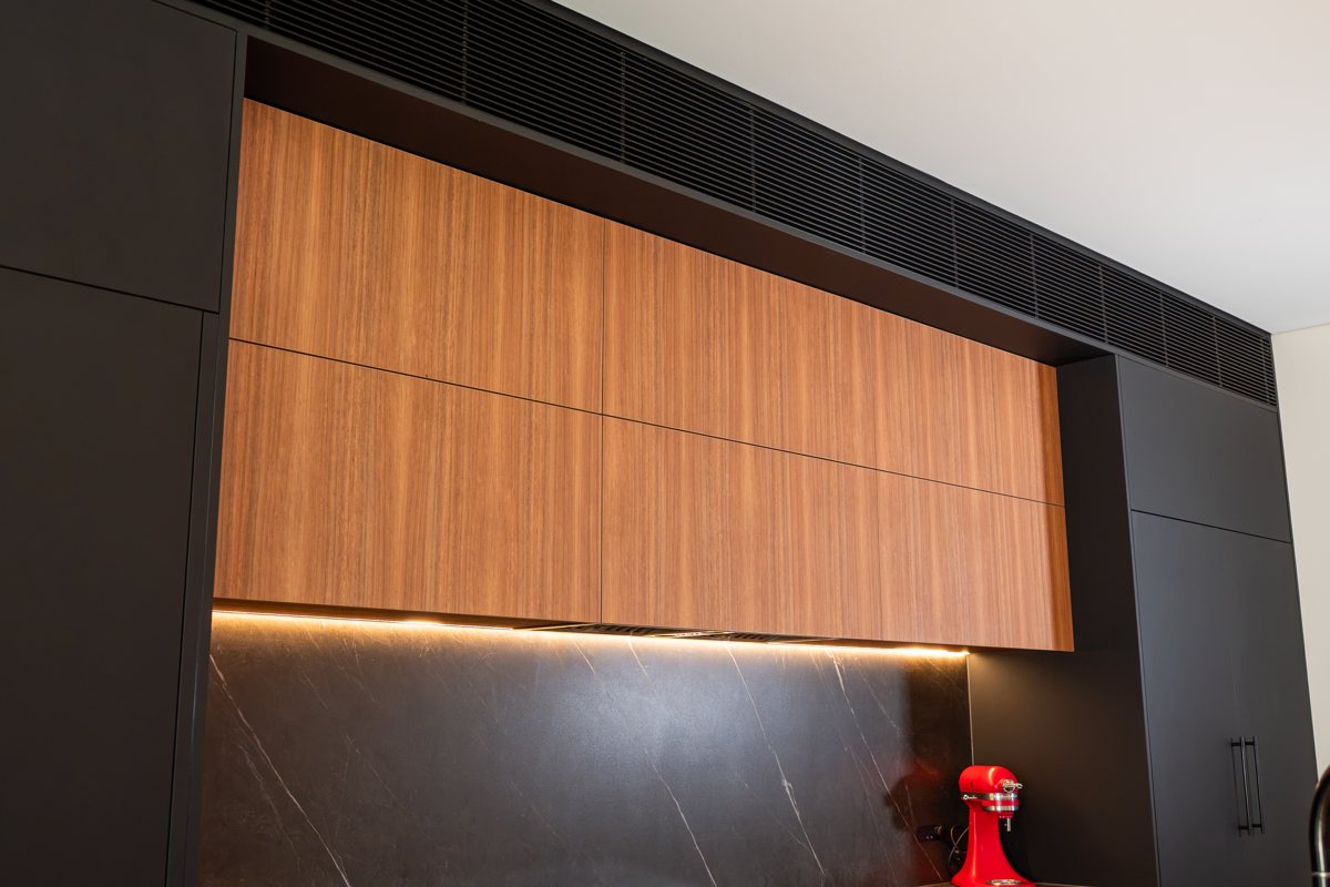 Ducted air conditioning outlet above kitchen joinery