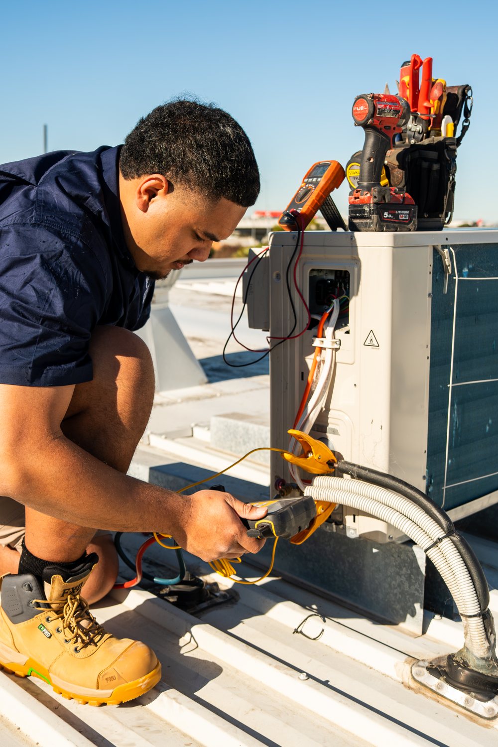 Technician servicing a split system